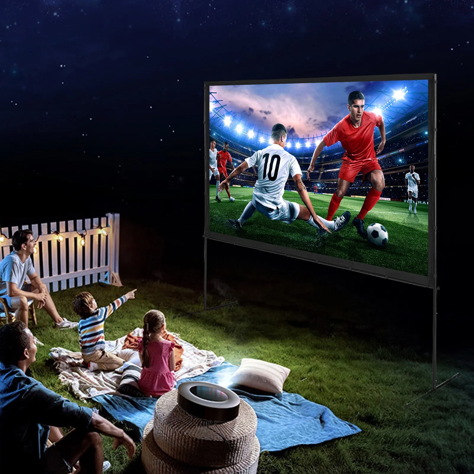 family watching a soccer match on VEVOR projector screen outdoors at night.