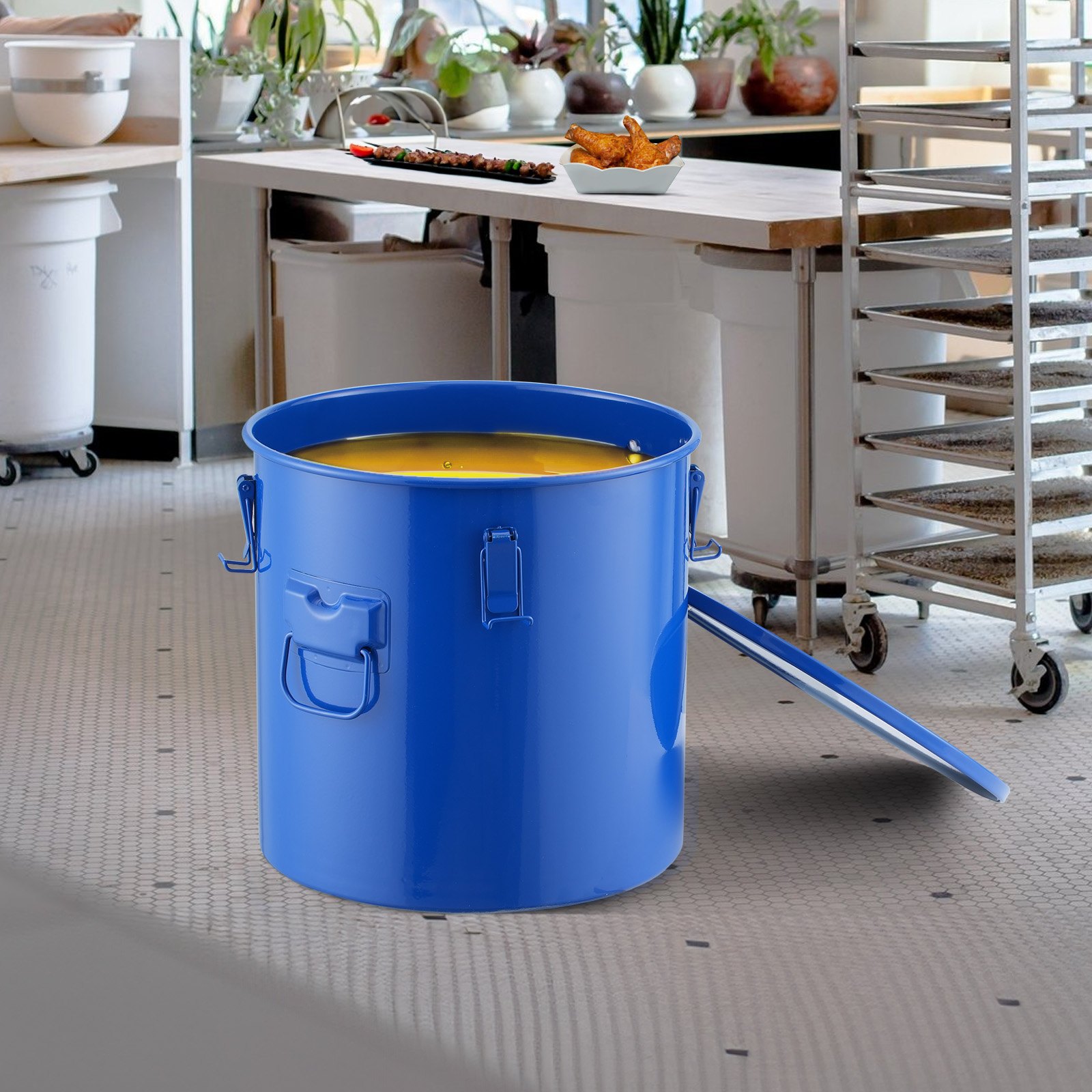 blue VEVOR fryer grease bucket in commercial kitchen, near prep table and storage racks.