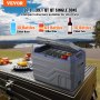 Refrigerador portátil para automóvil VEVOR sobre una mesa de picnic, con bebidas y comida, con montañas y un lago de fondo.