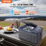 VEVOR portable car refrigerator on table by scenic view, holding bottled beverages with picnic items nearby.