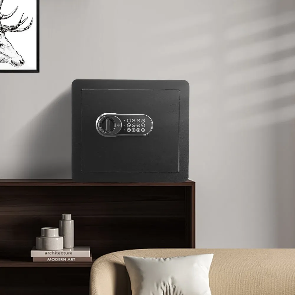 black VEVOR home safe on a wooden shelf in a minimalistic living room with books and art decor.