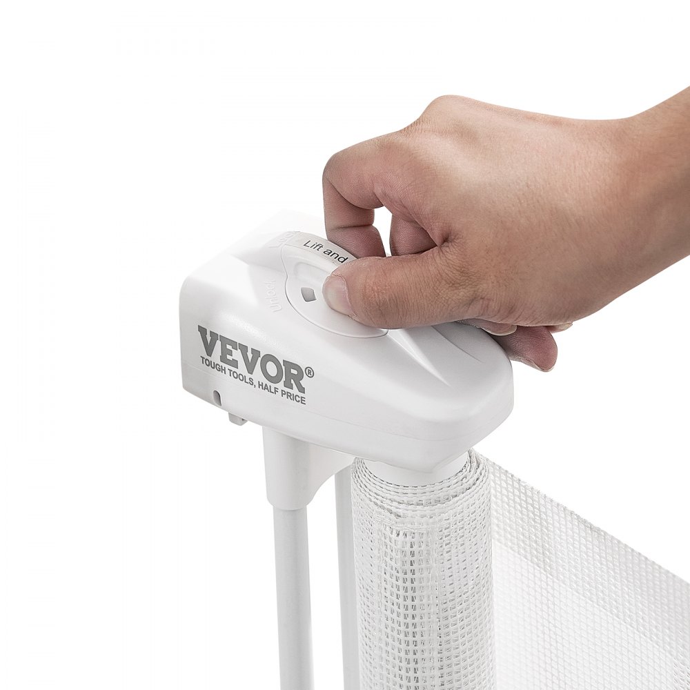 hand operating the white VEVOR retractable baby gate lock mechanism.
