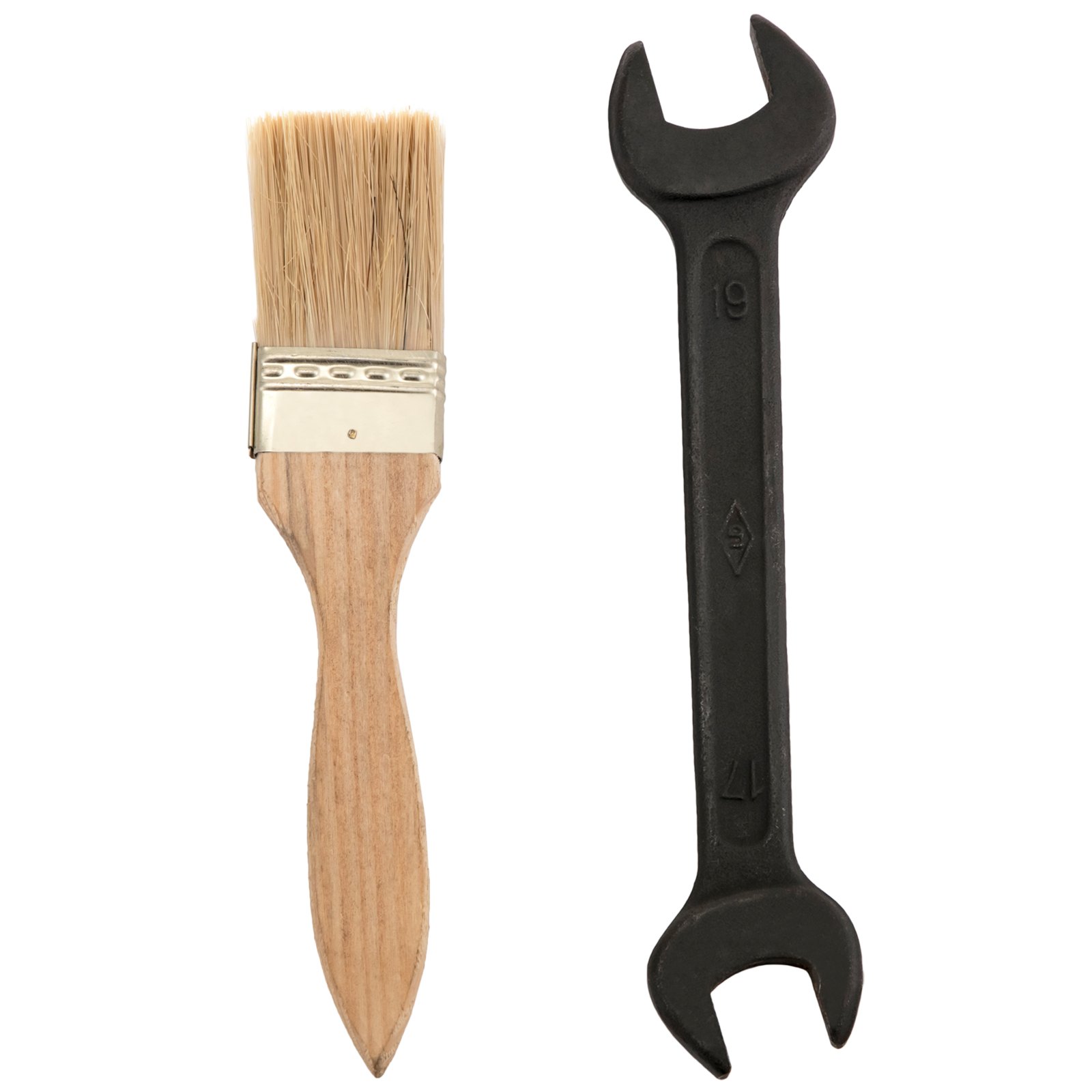 paintbrush with wooden handle and black metal wrench side by side.