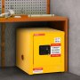 yellow VEVOR flammable cabinet under a workbench with tools on top.