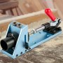 VEVOR pocket hole jig kit with red handle on a woodworking bench.