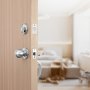 VEVOR front door handle set on a wooden door with a modern living room background.