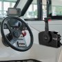 VEVOR mercury remote control box installed in a boat&#039;s cockpit with steering wheel.