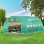 VEVOR walk-in tunnel greenhouse with blooming flowers, surrounded by green lawn and trees.
