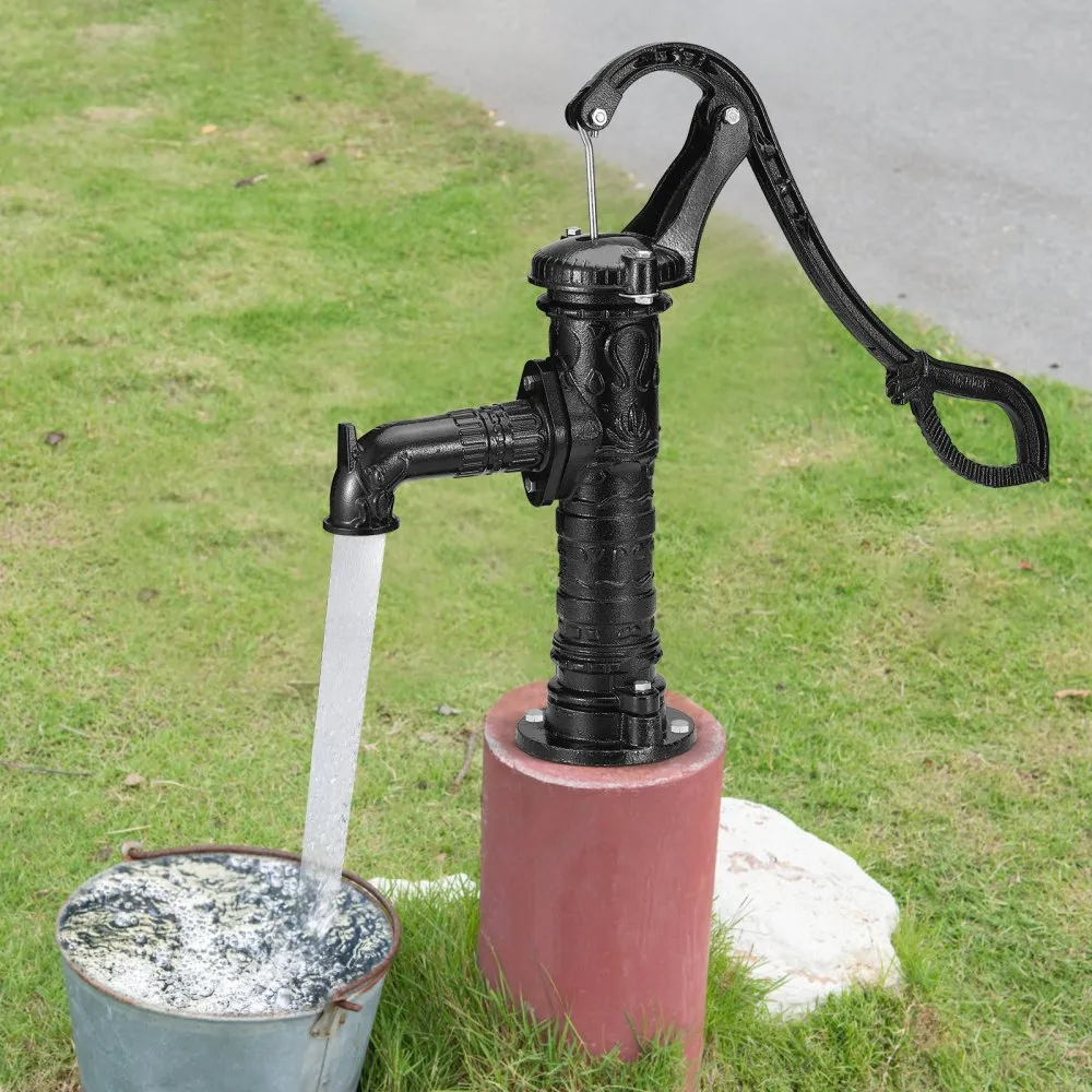 black VEVOR antique hand water pump filling a bucket on green grass background.