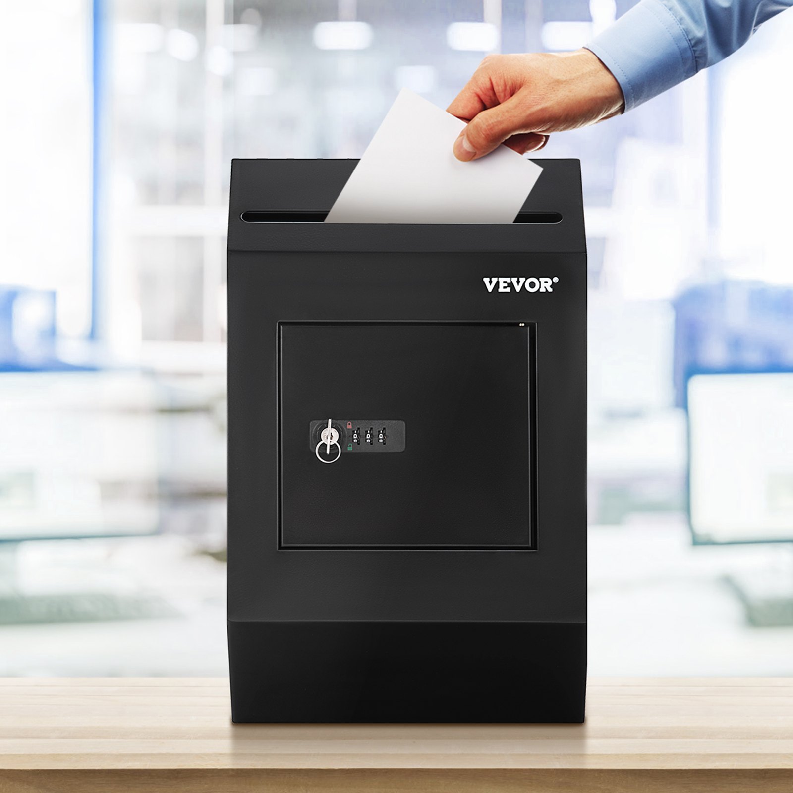 hand dropping paper into a black VEVOR suggestion box with combination lock on a wooden table.