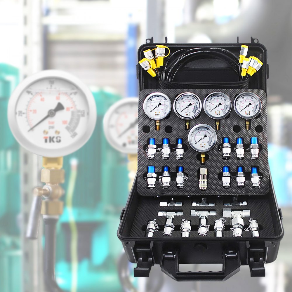black case with gauges and fittings for VEVOR hydraulic pressure test kit against industrial backdrop.