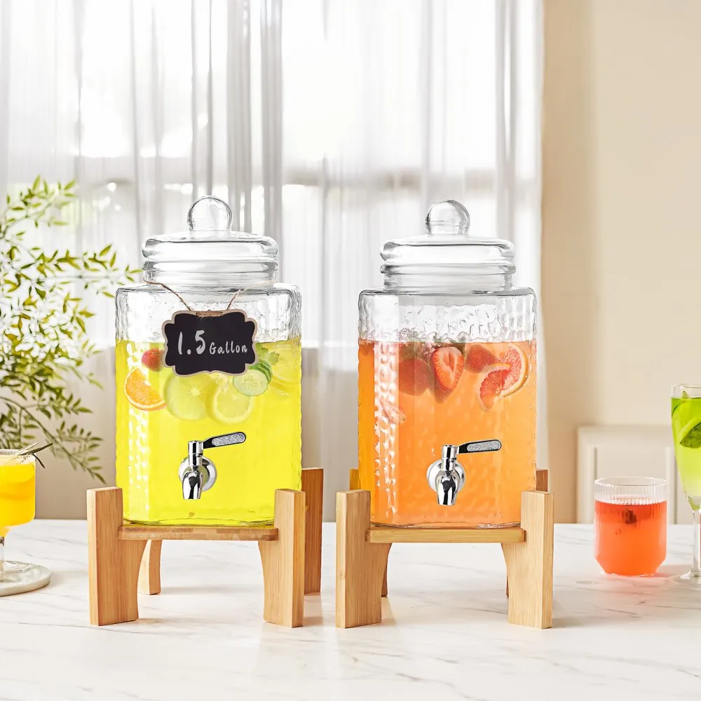VEVOR beverage dispenser, 1.5 gallon glass jars on wooden stands with fruit-infused drinks on a white table.