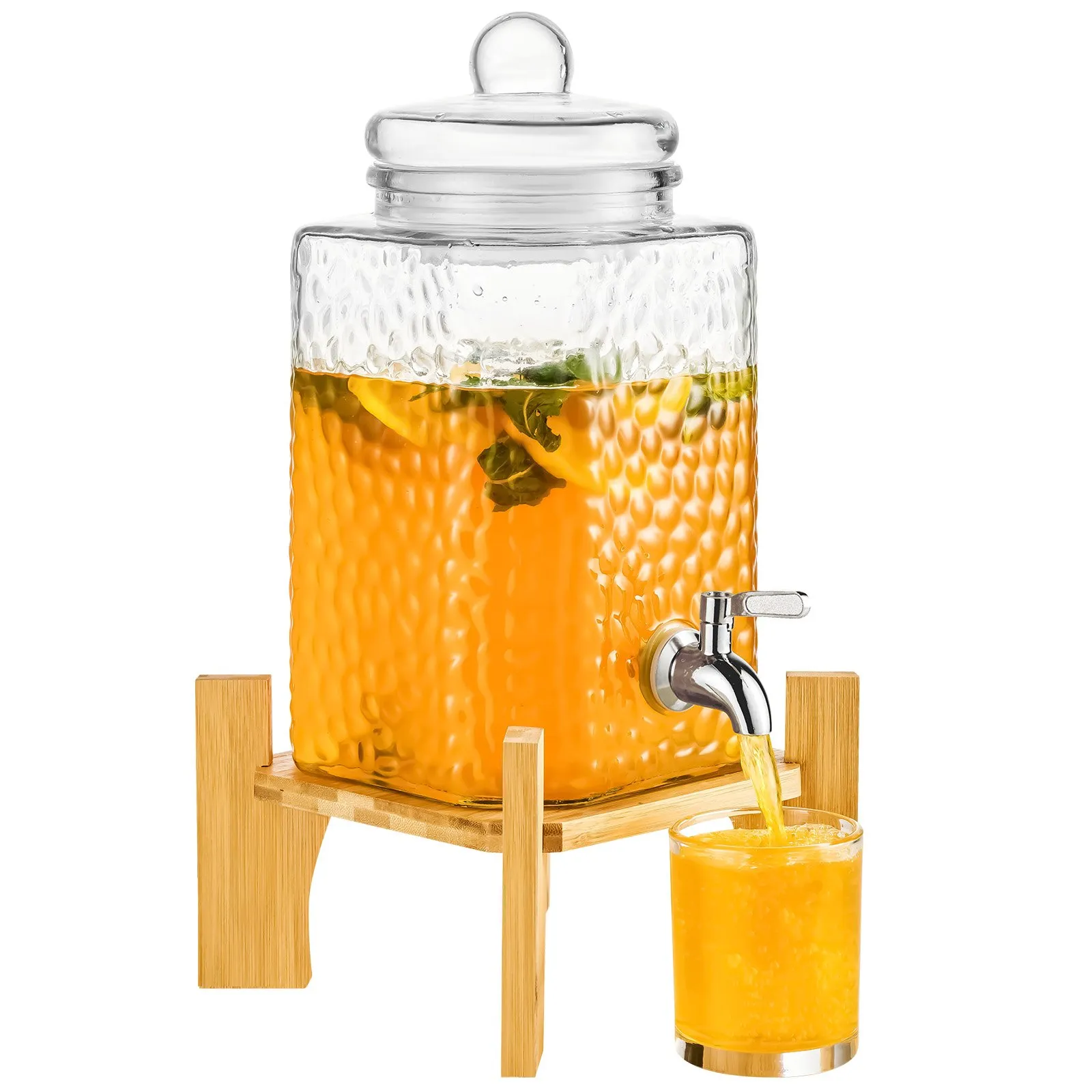 VEVOR beverage dispenser with glass container on bamboo stand, dispensing orange drink into a glass.