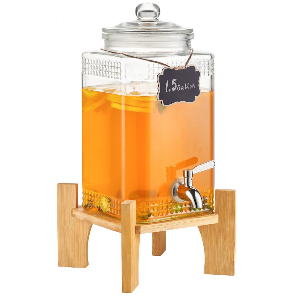 glass VEVOR beverage dispenser filled with orange liquid and lemon slices on a wooden stand.