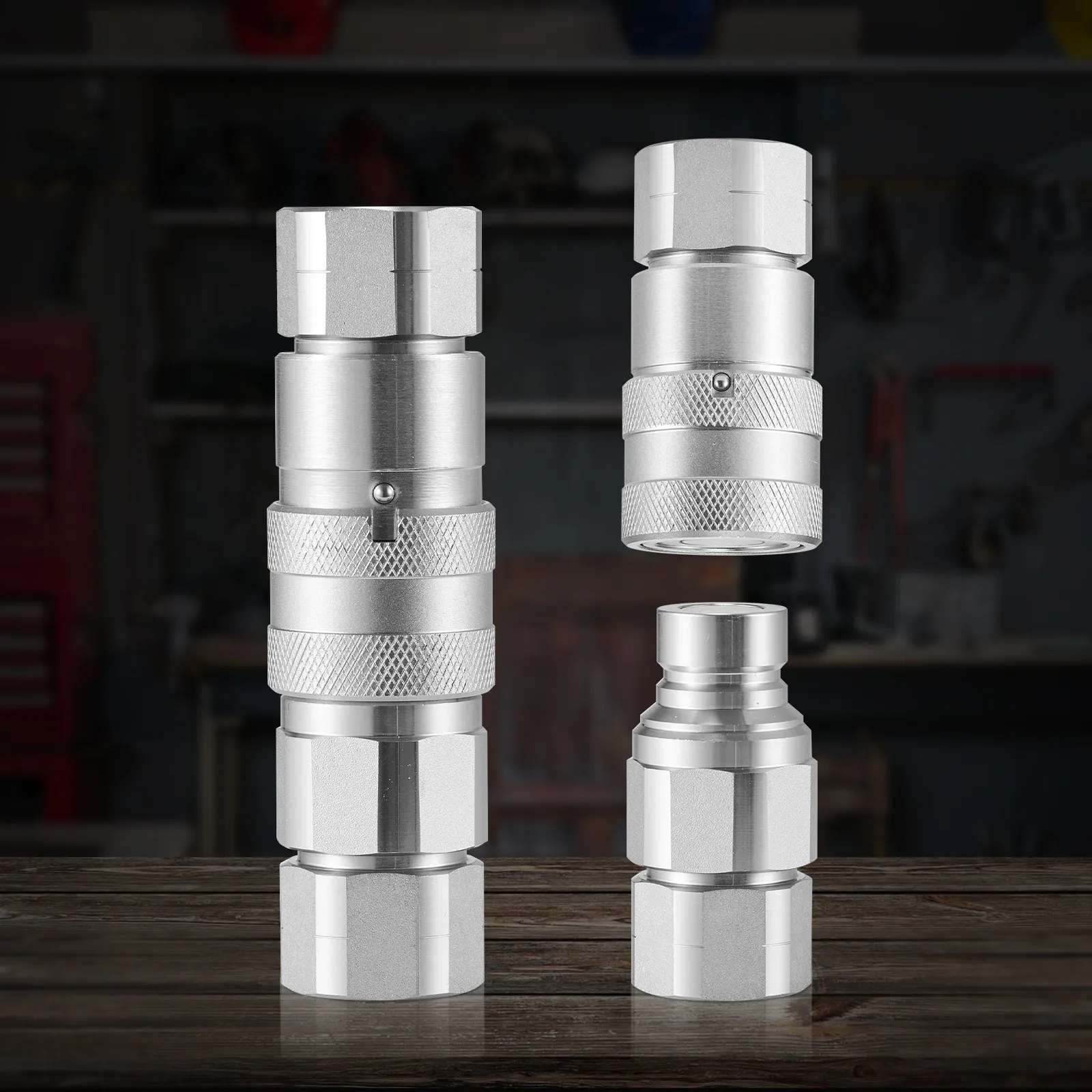VEVOR hydraulic couplers on a wooden table with a workshop background.