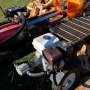 VEVOR hydraulic log splitter pump mounted on a powerful log splitting machine, splitting a large log.