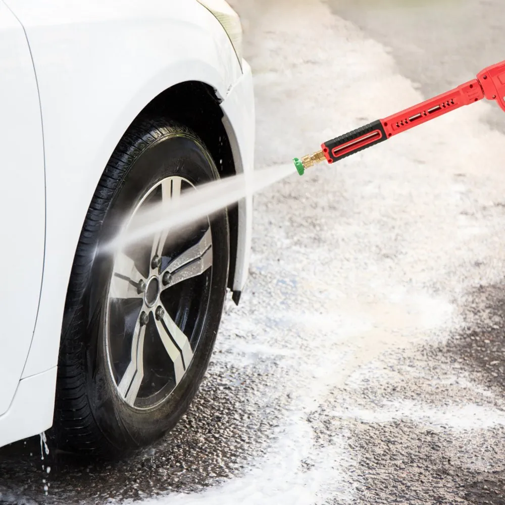 cleaning car wheel with VEVOR high pressure washer gun on a sunny day.