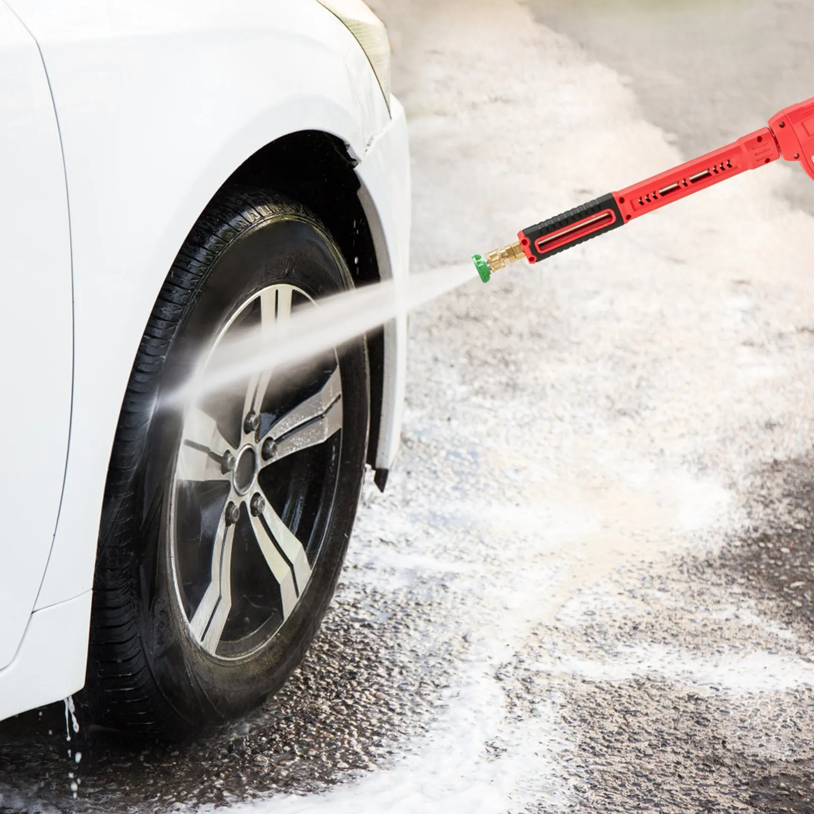 cleaning car wheel with VEVOR high pressure washer gun on a sunny day.