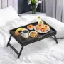 VEVOR bed tray table on a white bed, holding a breakfast of donuts, fruit, coffee, and flowers.