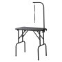 VEVOR pet grooming table with adjustable arm, black frame, and non-slip surface.