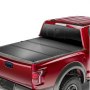 red pickup truck with VEVOR tri-fold truck bed tonneau cover, providing secure rear cargo protection.