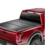 red truck with VEVOR tri-fold truck bed cover installed, showcasing sleek and secure fit.