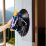 hand using VEVOR glass lifter to lift a glass panel, balcony view in background.