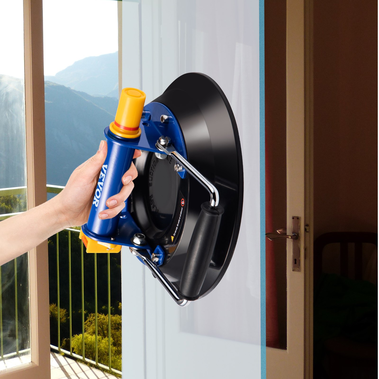 hand using VEVOR glass lifter to lift a glass panel, balcony view in background.