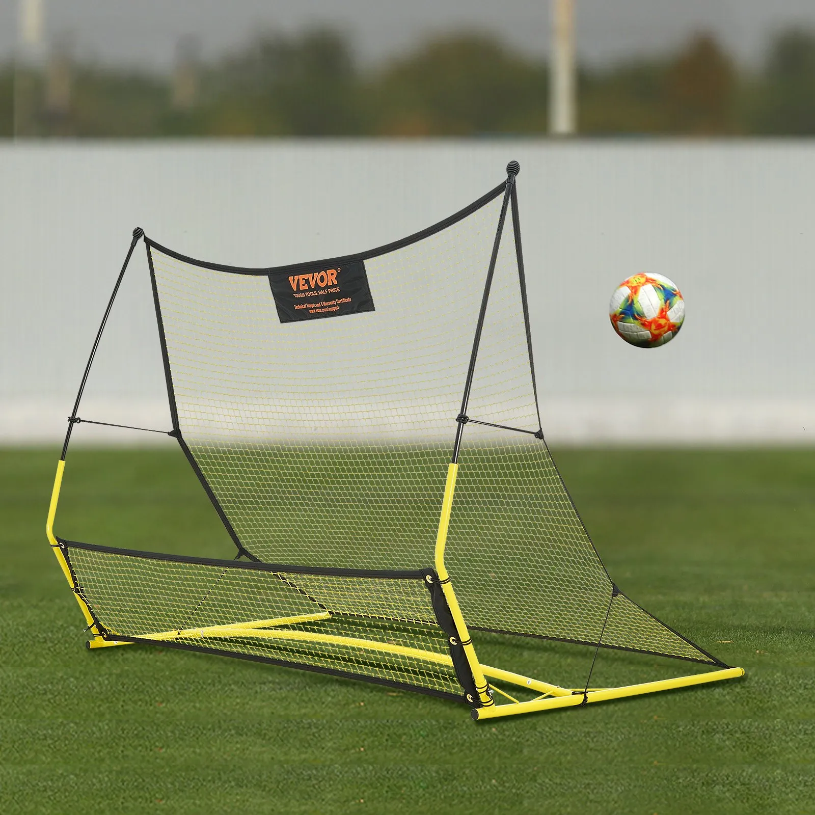 VEVOR soccer rebounder in action with a colorful soccer ball against a grassy field.