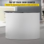 VEVOR exhibition counter stand at a trade show for displaying products.