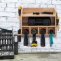 VEVOR power tool organizer holding drills and hand tools mounted on a white brick wall.