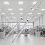 VEVOR linear guide rails in a well-equipped industrial workshop with ample lighting and organized shelves.