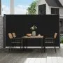 outdoor dining setup with table and chairs beside VEVOR retractable side awning.