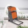 VEVOR folding chair dolly loaded with orange chairs on a patio near a lake.