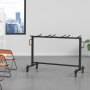 VEVOR folding chair cart holding stacked orange folding chairs in a modern office setting.