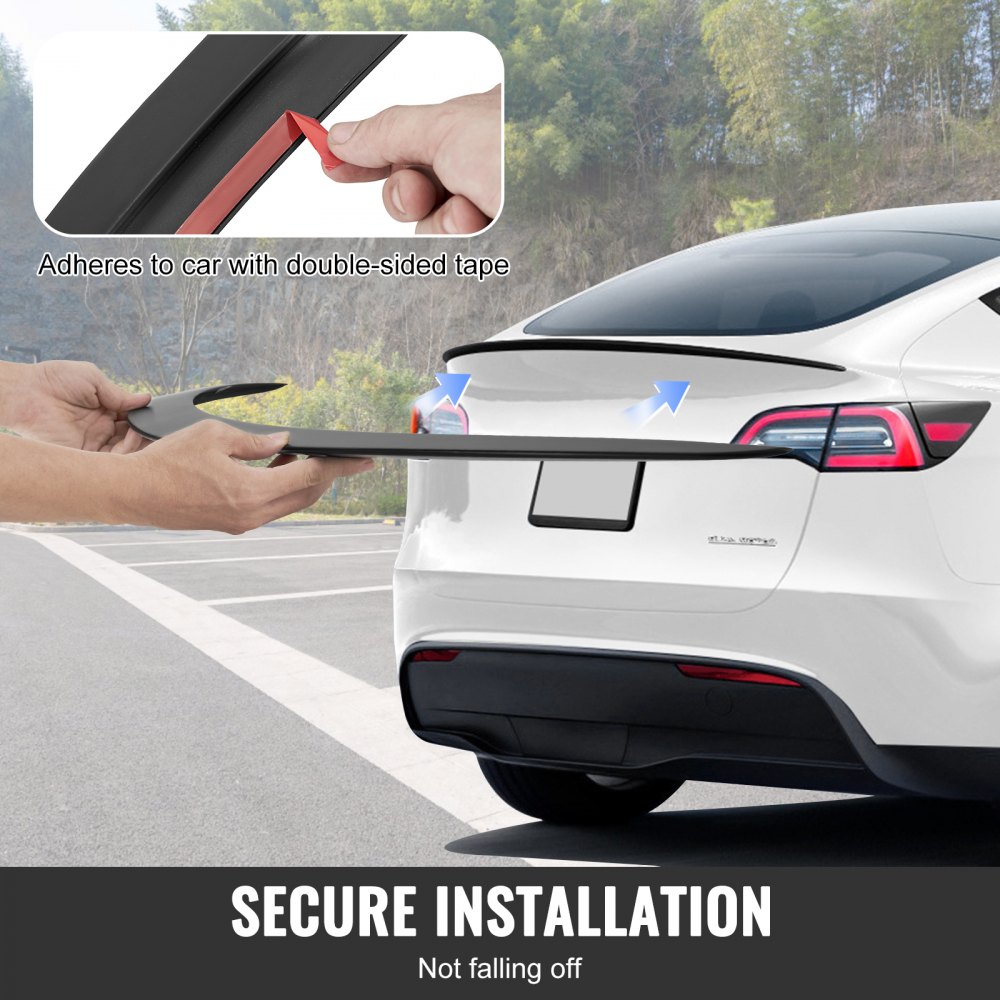 installing VEVOR tesla model y spoiler using double-sided tape for secure attachment.