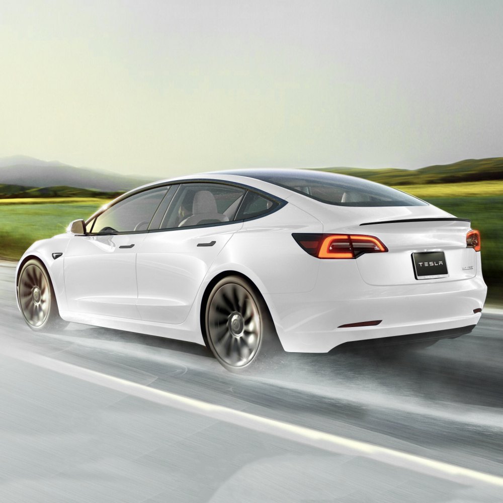 tesla model y driving fast on the road with sleek wheels and VEVOR tesla model y spoiler.