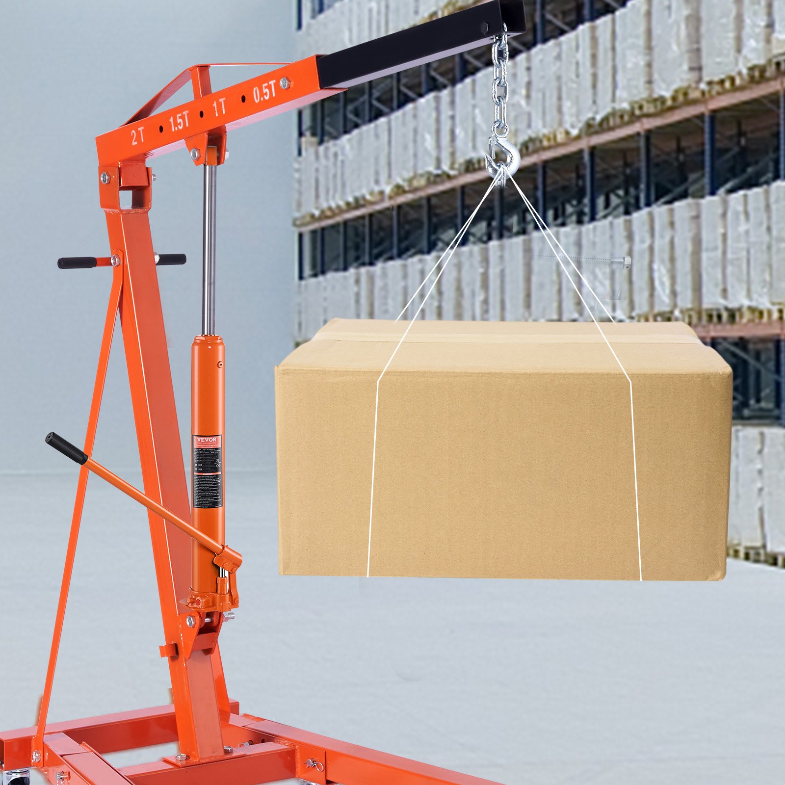 VEVOR hydraulic jack lifting a cardboard box in a warehouse with shelves filled with packages.