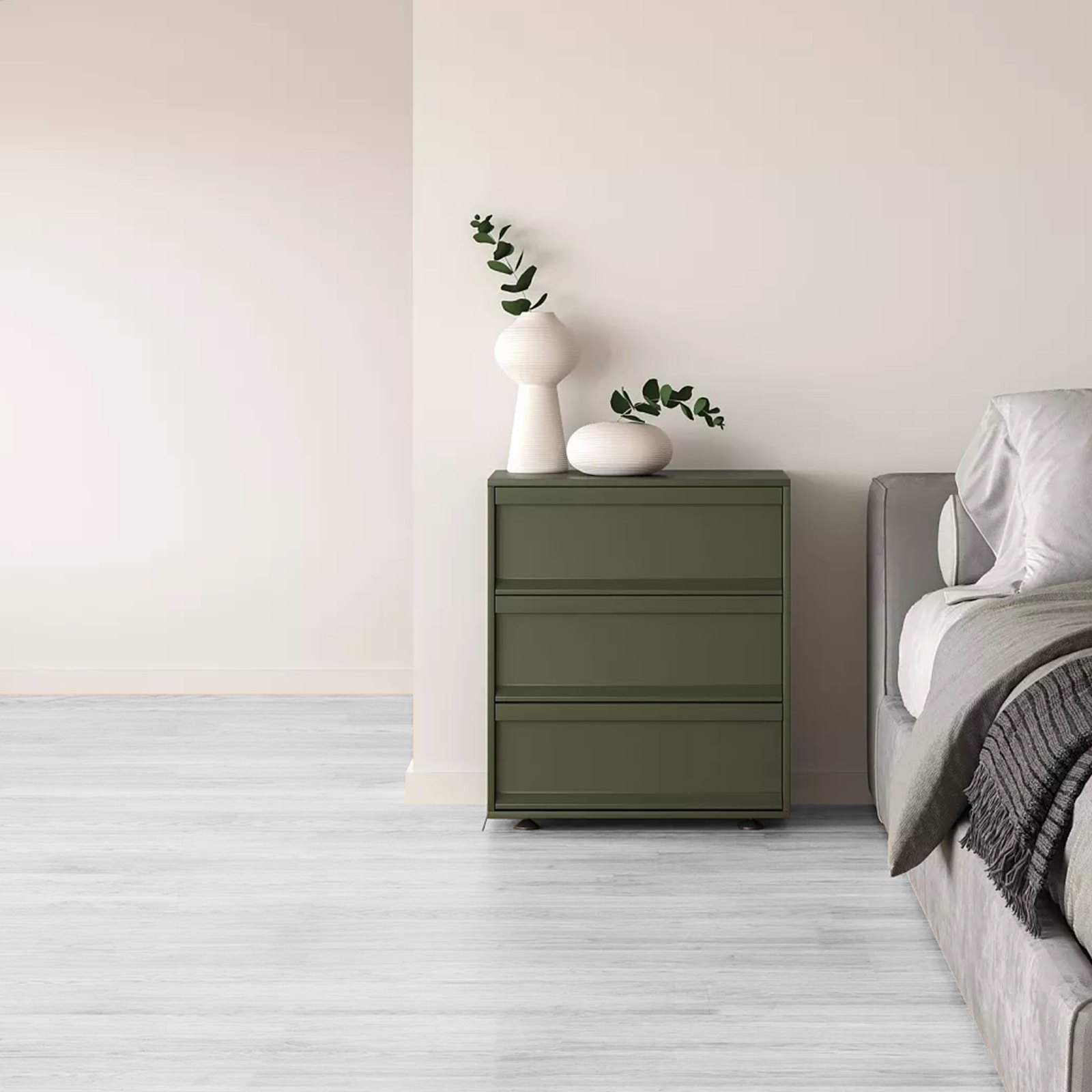 minimalist bedroom with gray bed, olive-green dresser, and white VEVOR vinyl floor tiles.